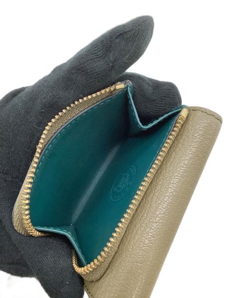 ANYA HINDMARCH（アニヤ・ハインドマーチ）ANYA HINDMARCH (アニヤ・ハインドマーチ) コンパクトウォレット カーキの古着・服飾アイテム