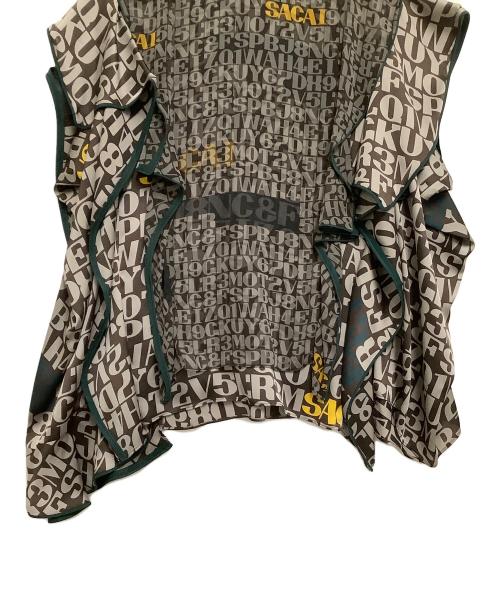 sacai（サカイ）sacai (サカイ) 半袖ブラウス　数字×ローマ字模様 ブラウン×グリーン サイズ:3の古着・服飾アイテム