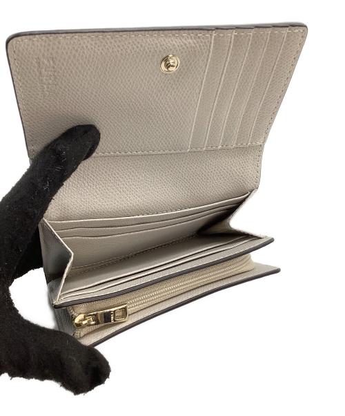 FURLA（フルラ）FURLA (フルラ) 2つ折り財布 カメリア ブルーの古着・服飾アイテム