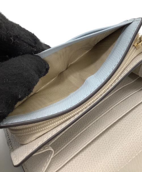 FURLA（フルラ）FURLA (フルラ) 2つ折り財布 カメリア ブルーの古着・服飾アイテム