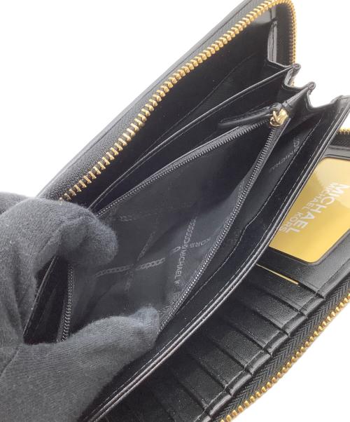 MICHAEL KORS（マイケルコース）MICHAEL KORS (マイケルコース) ラウンドファスナー財布　アニマル柄 ブラック×ホワイトの古着・服飾アイテム