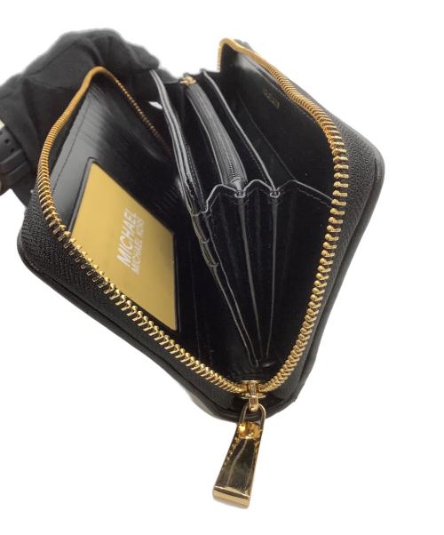 MICHAEL KORS（マイケルコース）MICHAEL KORS (マイケルコース) ラウンドファスナー財布　アニマル柄 ブラック×ホワイトの古着・服飾アイテム