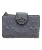 COACHコーチ）の古着「2つ折り財布 シグネチャー」｜スカイブルー