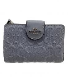 COACH（コーチ）の古着「2つ折り財布 シグネチャー」｜スカイブルー