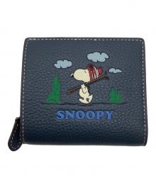 COACH×PEANUTS（コーチ×ピーナッツ）の古着「スナップ ウォレット・スヌーピー スキー モチーフ」