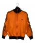 adidas（アディダス）の古着「トラックジャケット」｜オレンジ