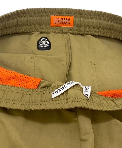 UNIVERSAL OVERALL（ユニバーサルオーバーオール）UNIVERSAL OVERALL (ユニバーサルオーバーオール) ATHLETA (アスレタ) ポケッタブルショーツ ベージュ サイズ:SIZE XL 未使用品の古着・服飾アイテム