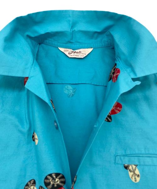 Star OF HOLLYWOOD（スターオブハリウッド）Star OF HOLLYWOOD (スターオブハリウッド) 半袖COTTON TYPEWRITER OPEN SHIRT “ROCK 'N' ROLL GUITAR” ターコイズブルー サイズ:SIZE Sの古着・服飾アイテム