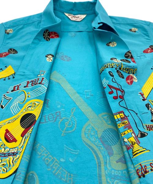 Star OF HOLLYWOOD（スターオブハリウッド）Star OF HOLLYWOOD (スターオブハリウッド) 半袖COTTON TYPEWRITER OPEN SHIRT “ROCK 'N' ROLL GUITAR” ターコイズブルー サイズ:SIZE Sの古着・服飾アイテム