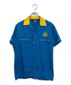 comedy central×Hiltonコメディセントラル×ヒルトン）の古着「半袖シャツ」｜ブルー×イエロー