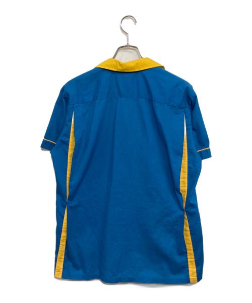 comedy central（コメディセントラル）comedy central (コメディセントラル) Hilton (ヒルトン) 半袖シャツ ブルー×イエロー サイズ:SIZE L (US M)の古着・服飾アイテム