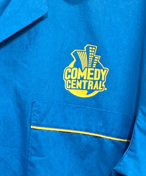 comedy central（コメディセントラル）comedy central (コメディセントラル) Hilton (ヒルトン) 半袖シャツ ブルー×イエロー サイズ:SIZE L (US M)の古着・服飾アイテム