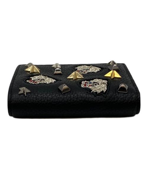 Christian Louboutin（クリスチャン・ルブタン）Christian Louboutin (クリスチャン・ルブタン) スタッズモチーフ二つ折り財布 ブラックの古着・服飾アイテム