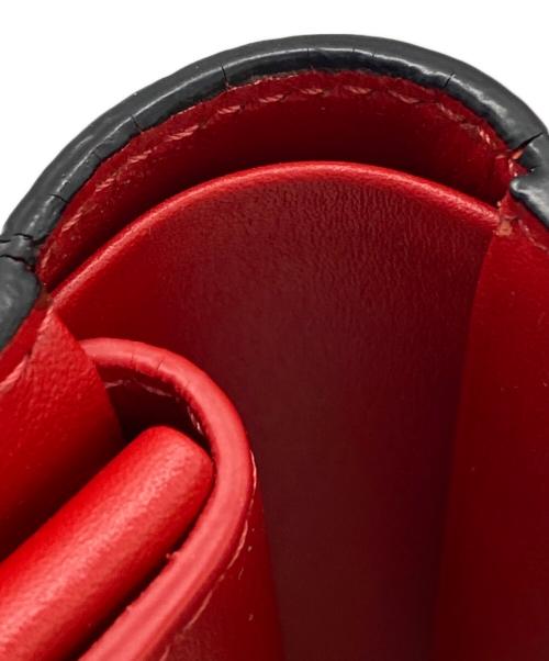 Christian Louboutin（クリスチャン・ルブタン）Christian Louboutin (クリスチャン・ルブタン) スタッズモチーフ二つ折り財布 ブラックの古着・服飾アイテム