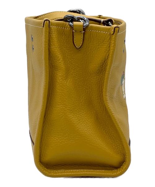 COACH（コーチ）COACH (コーチ) PEANUTS (ピーナッツ) 2WAYバッグ イエローの古着・服飾アイテム