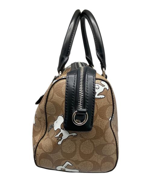 COACH（コーチ）COACH (コーチ) PEANUTS (ピーナッツ) シグネチャースヌーピーローワンサッチェルバッグ ブラウンの古着・服飾アイテム