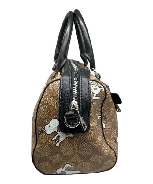 COACH（コーチ）COACH (コーチ) PEANUTS (ピーナッツ) シグネチャースヌーピーローワンサッチェルバッグ ブラウンの古着・服飾アイテム