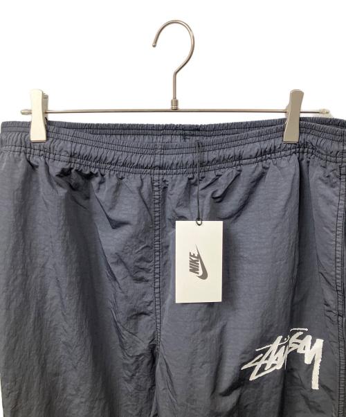 stussy（ステューシー）stussy (ステューシー) NIKE (ナイキ) Beach Pants Bright Cactus グレー サイズ:Lの古着・服飾アイテム