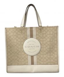 COACH（コーチ）の古着「ジャカード ウィズ ストライプ アンド コーチ パッチ」｜ベージュ×ホワイト