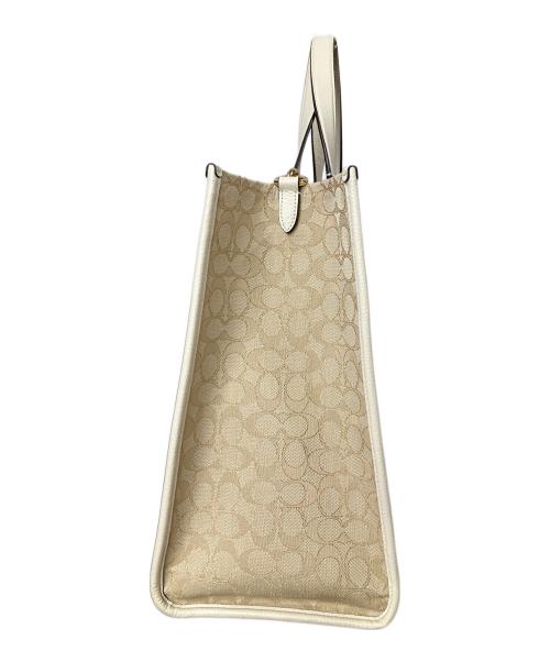 COACH（コーチ）COACH (コーチ) ジャカード ウィズ ストライプ アンド コーチ パッチ ベージュ×ホワイトの古着・服飾アイテム