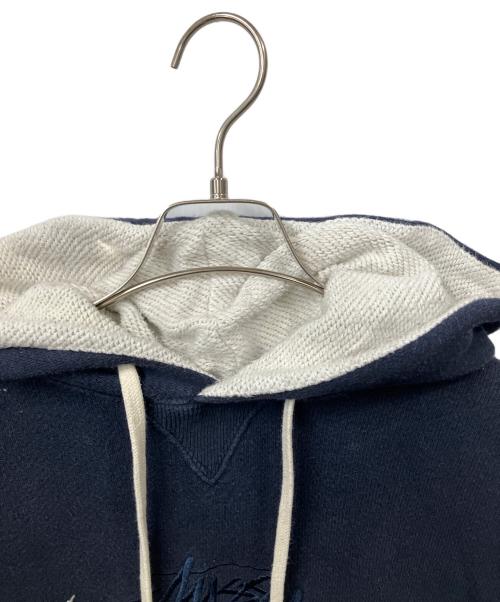 Champion（チャンピオン）Champion (チャンピオン) stussy (ステューシー) stussy×Championプルオーバーパーカー ネイビー サイズ:Mの古着・服飾アイテム