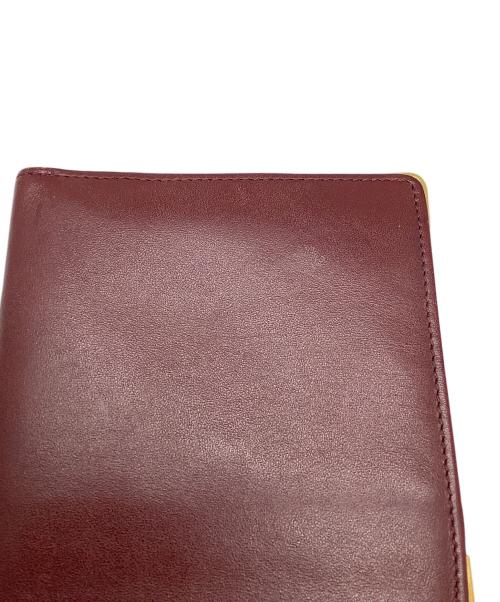 Cartier（カルティエ）Cartier (カルティエ) マストライン 2つ折り財布 ボルドー ボルドーの古着・服飾アイテム