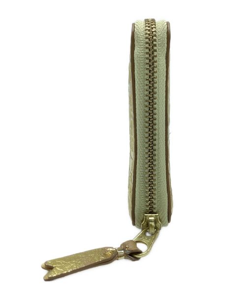 COMME des GARCONS（コムデギャルソン）COMME des GARCONS (コムデギャルソン) 2つ折り財布 ゴールドの古着・服飾アイテム