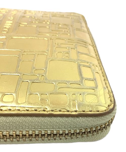 COMME des GARCONS（コムデギャルソン）COMME des GARCONS (コムデギャルソン) 2つ折り財布 ゴールドの古着・服飾アイテム