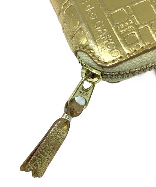 COMME des GARCONS（コムデギャルソン）COMME des GARCONS (コムデギャルソン) 2つ折り財布 ゴールドの古着・服飾アイテム