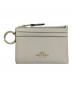 COACH（コーチ）の古着「カードケース」｜アイボリー×ゴールド