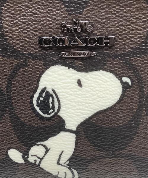 COACH（コーチ）COACH (コーチ) PEANUTS (ピーナッツ) 2つ折り財布 ブラウンの古着・服飾アイテム