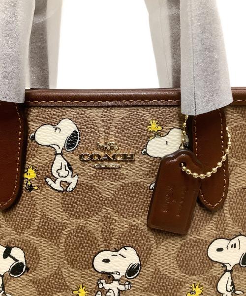 COACH（コーチ）COACH (コーチ) PEANUTS (ピーナッツ) ミニ2WAYバッグ ブラウン 未使用品の古着・服飾アイテム
