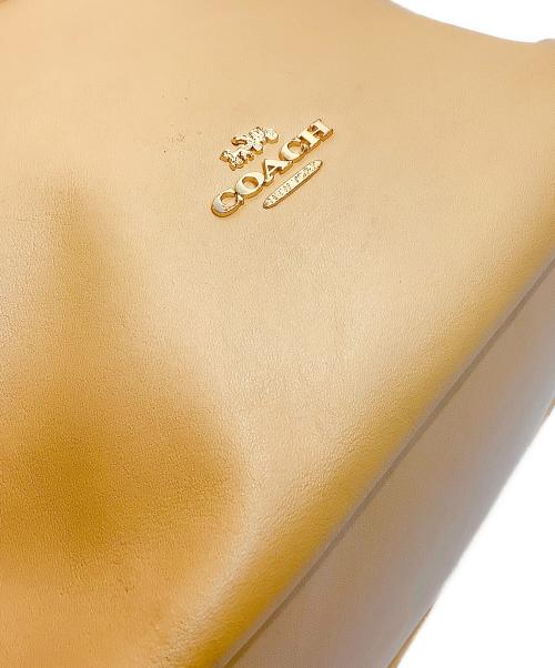 COACH（コーチ）COACH (コーチ) フェイ ドローストリングトートバッグ ベージュの古着・服飾アイテム