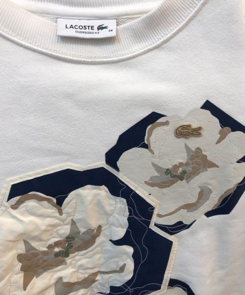 LACOSTE（ラコステ）LACOSTE (ラコステ) クルーネックスウェット フラワーグラフィック ホワイト サイズ:34の古着・服飾アイテム