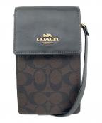 COACHコーチ）の古着「ショルダーポーチ ノース／サウス フォーン クロスボディ・シグネチャー キャンバス」｜ブラウン