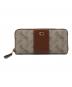 COACH（コーチ）の古着「エッセンシャルスリムアコーディオンジップウォレット ホースキャリッジ」｜ホワイト×ブラウン