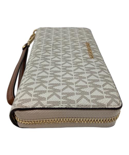 MICHAEL KORS（マイケルコース）MICHAEL KORS (マイケルコース) JET SET TRAVEL LG TRVL CONTINENTAL アイボリーの古着・服飾アイテム