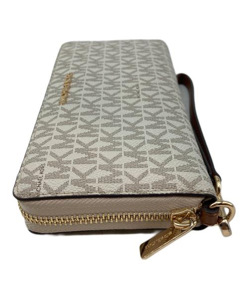 MICHAEL KORS（マイケルコース）MICHAEL KORS (マイケルコース) JET SET TRAVEL LG TRVL CONTINENTAL アイボリーの古着・服飾アイテム