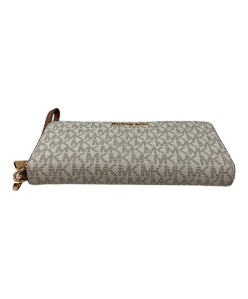 MICHAEL KORS（マイケルコース）MICHAEL KORS (マイケルコース) JET SET TRAVEL LG TRVL CONTINENTAL アイボリーの古着・服飾アイテム