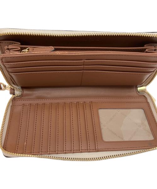 MICHAEL KORS（マイケルコース）MICHAEL KORS (マイケルコース) JET SET TRAVEL LG TRVL CONTINENTAL アイボリーの古着・服飾アイテム