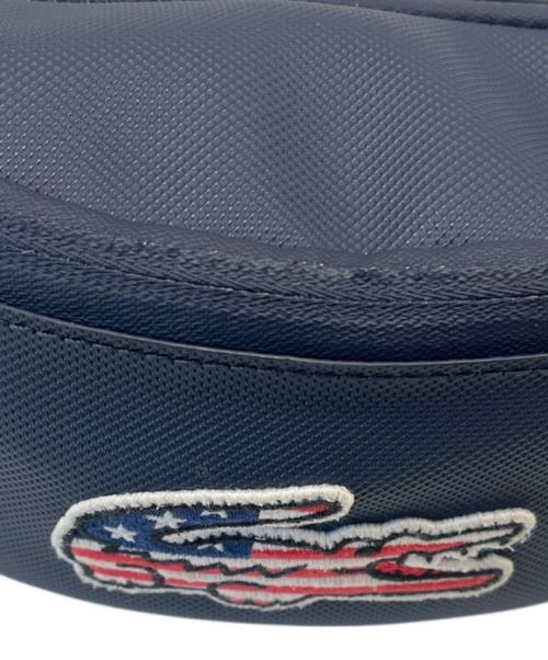 LACOSTE（ラコステ）LACOSTE (ラコステ) LACOSTE　ボディーバッグ　アメリカ国旗 ネイビーの古着・服飾アイテム