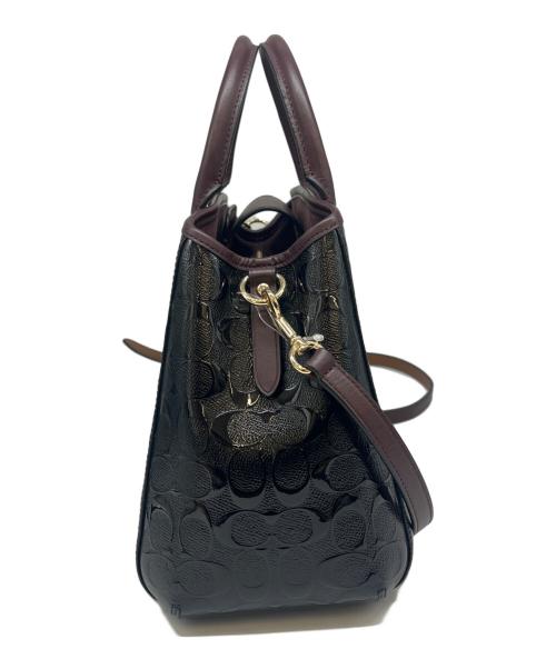 COACH（コーチ）COACH (コーチ) COACH  デボスド シグネチャー パテントレザー スモールマーゴット キャリーオール 2WAYバッグ ブラウン×ブラックの古着・服飾アイテム