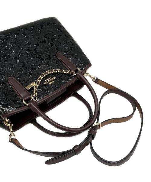 COACH（コーチ）COACH (コーチ) COACH  デボスド シグネチャー パテントレザー スモールマーゴット キャリーオール 2WAYバッグ ブラウン×ブラックの古着・服飾アイテム