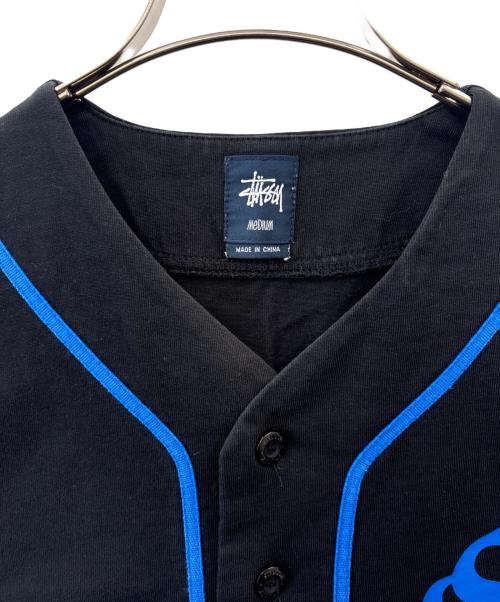 stussy（ステューシー）stussy (ステューシー) stussy　ベースボールシャツ　半袖シャツ ブラック サイズ:MEDIUMの古着・服飾アイテム