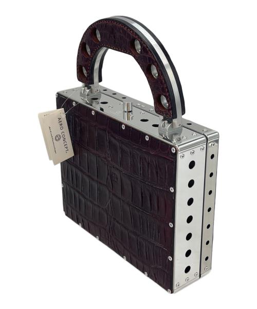 AERO CONCEPT（エアロコンセプト）AERO CONCEPT (エアロコンセプト) AERO CONCEPT　TICCO-CROCO　ジュラルミン　パーティバッグ ブラウンの古着・服飾アイテム