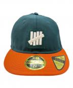 New Era×UNDEFEATEDニューエラ×アンディフィーテッド）の古着「New Era　UNDEFEATED　59FIFTY　キャップ」｜グリーン×オレンジ