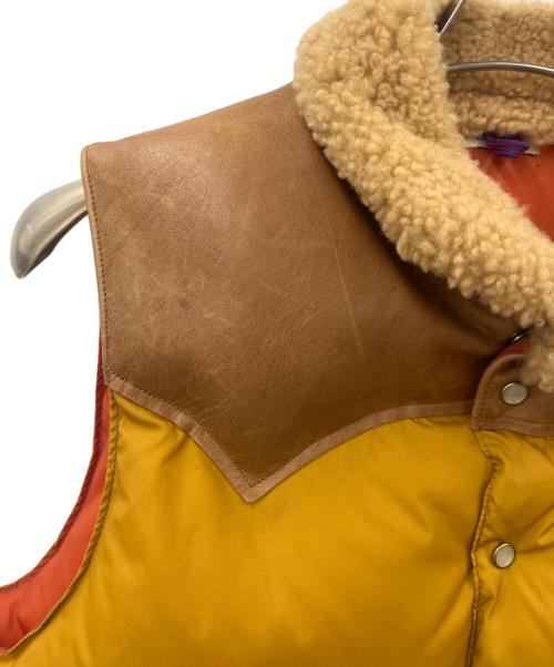 Rocky Mountain FeatherBed（ロッキーマウンテンフェザーベッド）Rocky Mountain FeatherBed (ロッキーマウンテンフェザーベッド) Rocky Mountain Featherbed　ダウンベスト ブラウン×オレンジ サイズ:36の古着・服飾アイテム