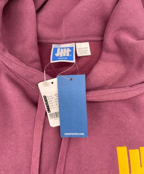 UNDEFEATED（アンディフィーテッド）UNDEFEATED (アンディフィーテッド) プルオーバーパーカー ピンク サイズ:Mの古着・服飾アイテム