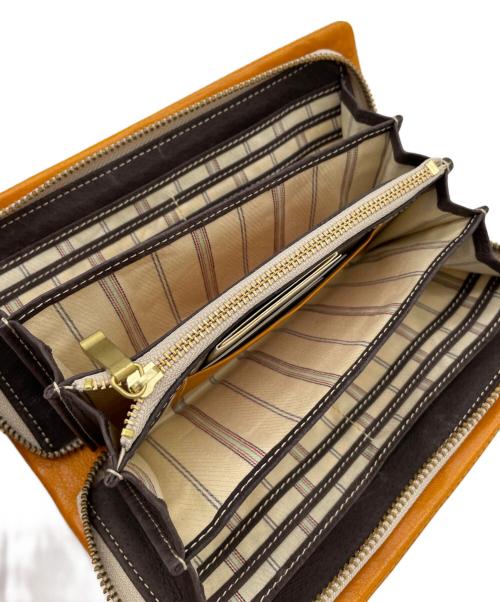 TAKEO KIKUCHI（タケオキクチ）TAKEO KIKUCHI (タケオキクチ) 長財布 オレンジの古着・服飾アイテム