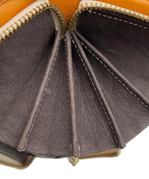 TAKEO KIKUCHI（タケオキクチ）TAKEO KIKUCHI (タケオキクチ) 長財布 オレンジの古着・服飾アイテム